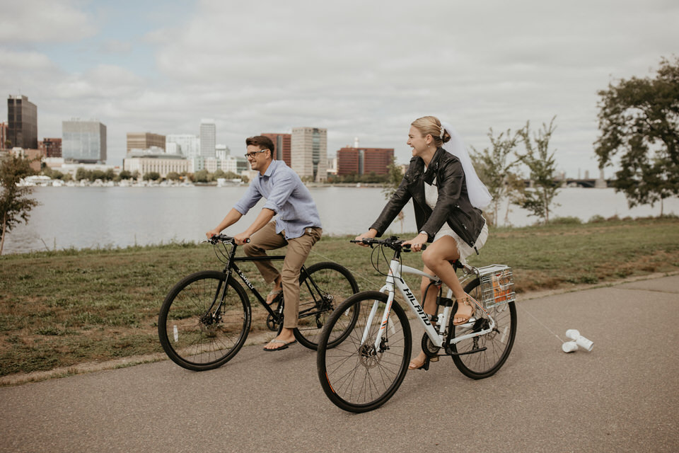 Elopement activity - riding bikes in the city with cans tied to the wheels