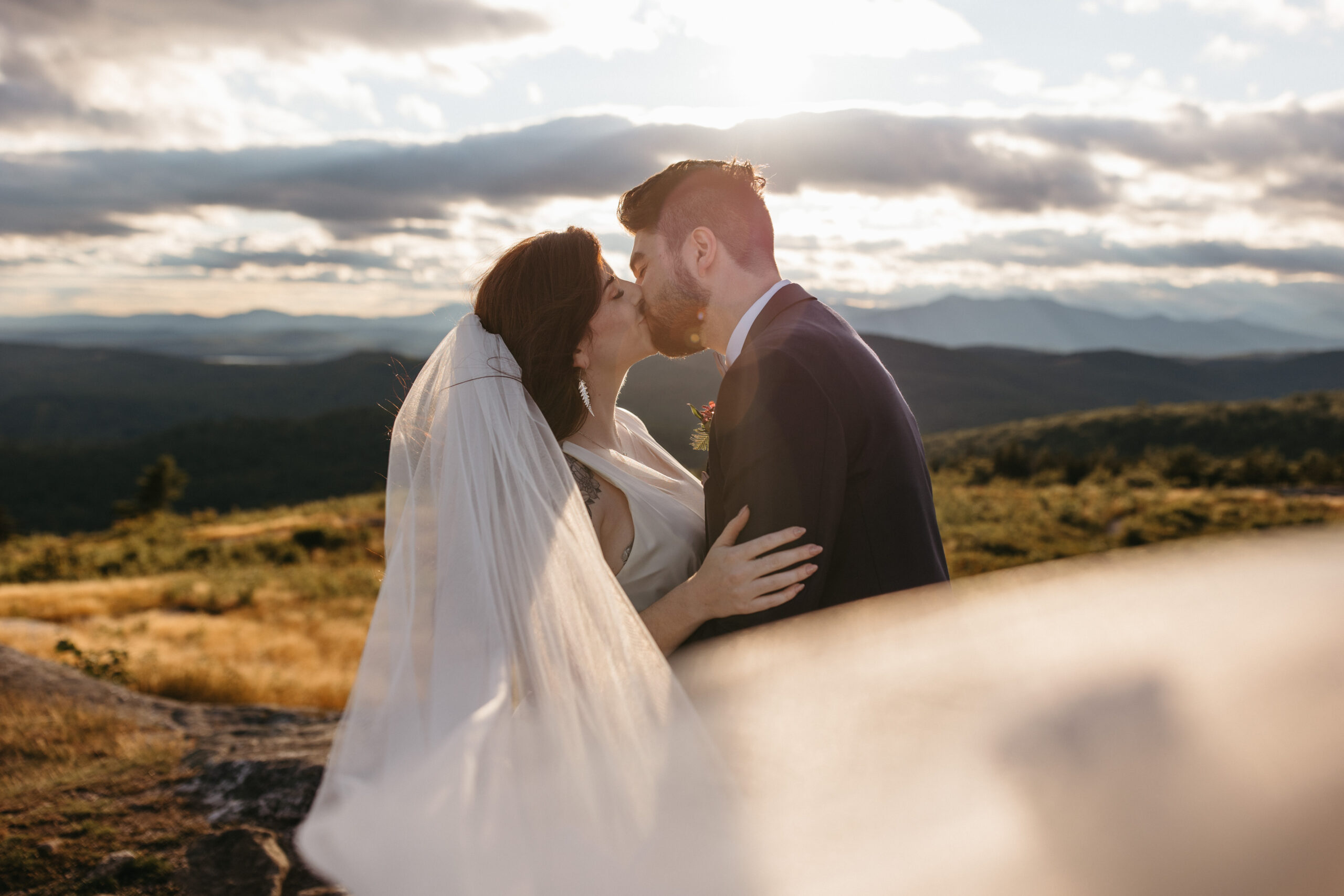 couple kissing at sunset in New Hampshire